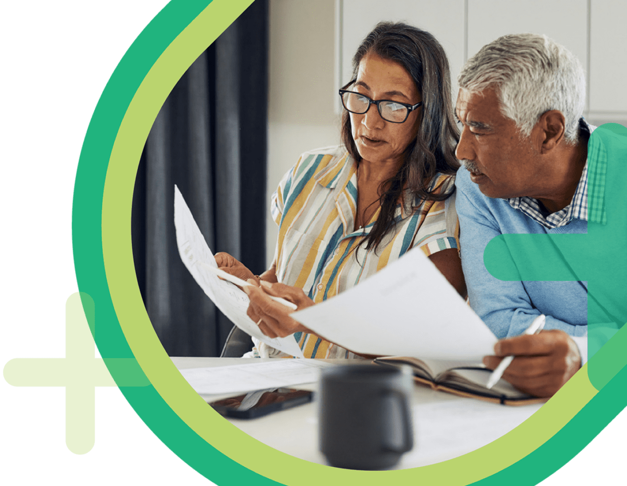 Middle aged couple sitting at a table while reading and discussing documents overlaid with Bromwich and Smith graphic elements.